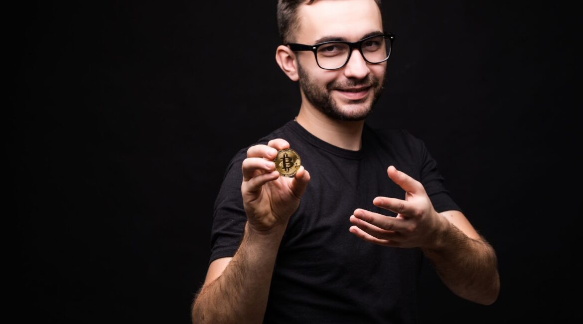 Man in glasses present bitcoin