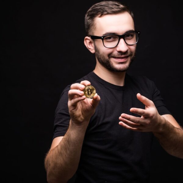 Man in glasses present bitcoin