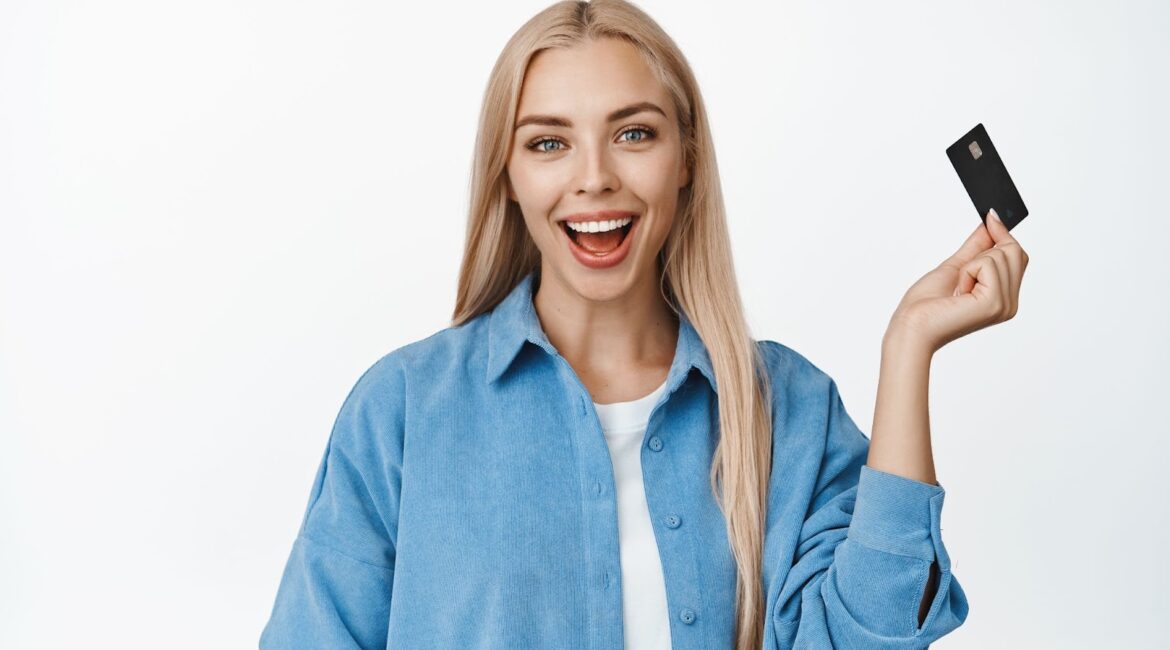 Happy woman with credit card