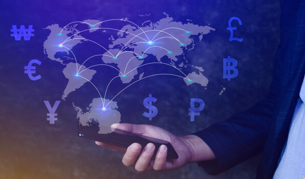 Hand holding a phone with global graphics showing a world map intersected by lines with currency symbols, representing international money transfer