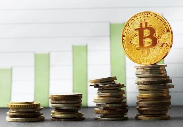 Stacks of Bitcoins =Bitcoin stacks against a rising chart
