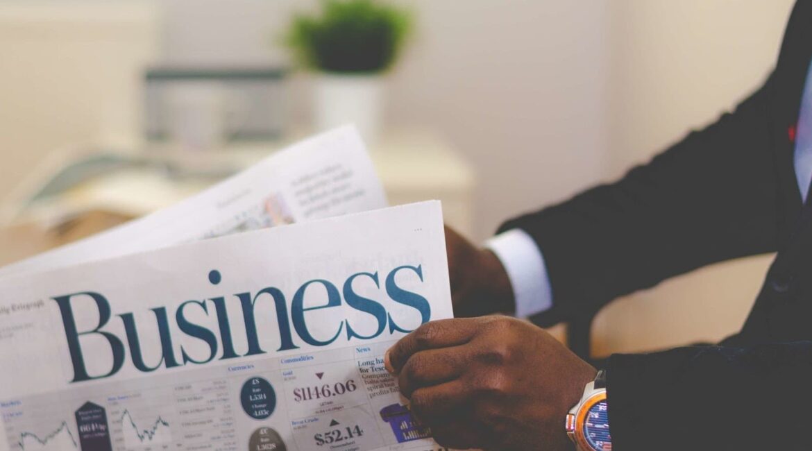 a man reading a business newspaper.